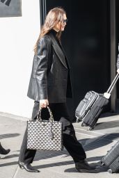 Karlie Kloss Wearing a Black Leather Jacket and Carrying a Prada Tote Bag - NYC 03/21/2023