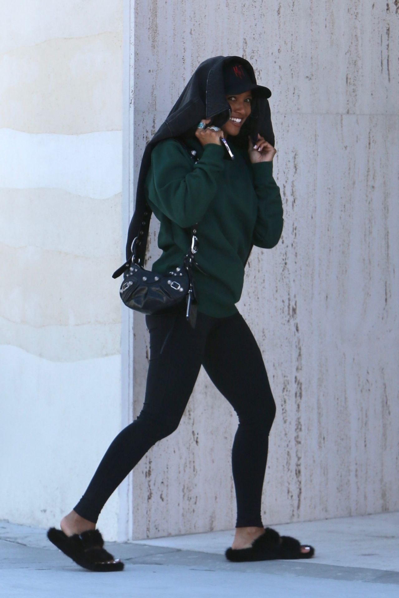 Karrueche Tran dons a grey hoodie and black leggings during a shopping trip  in Calabasas, California