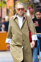 Dakota Fanning Wearing a Trench Coat and Blue Baggy Trousers - New York 04/22/2023