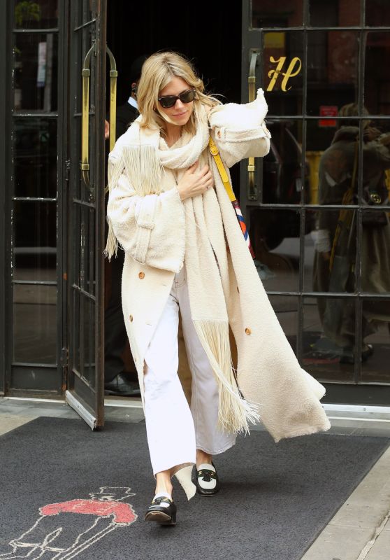 Sienna Miller Bundled Up in White, Gucci Loafers and Gucci Bag in New York 04/27/2023