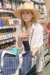 Elizabeth Olsen Wearing Birkenstock Sandals and a Sun Hat at Whole Foods in LA 04/29/2023