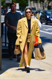 Hailey Rhode Bieber in a Yellow Trench Coat in New York 05/10/2023