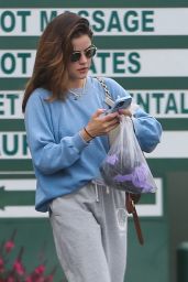 Lucy Hale in a Blue Sweater and Gray Sweatpants - Hollywood 05/24/2023