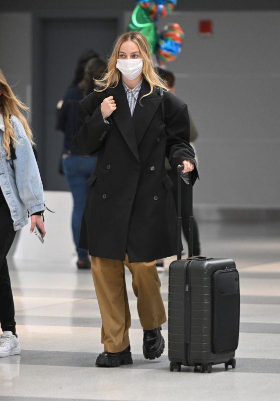 Margot Robbie at an Airport in New York 04/30/2023