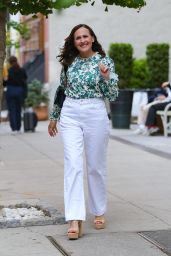 Molly Shannon in White Pants and Floral Long-Sleeve Top - New York 05/08/2023