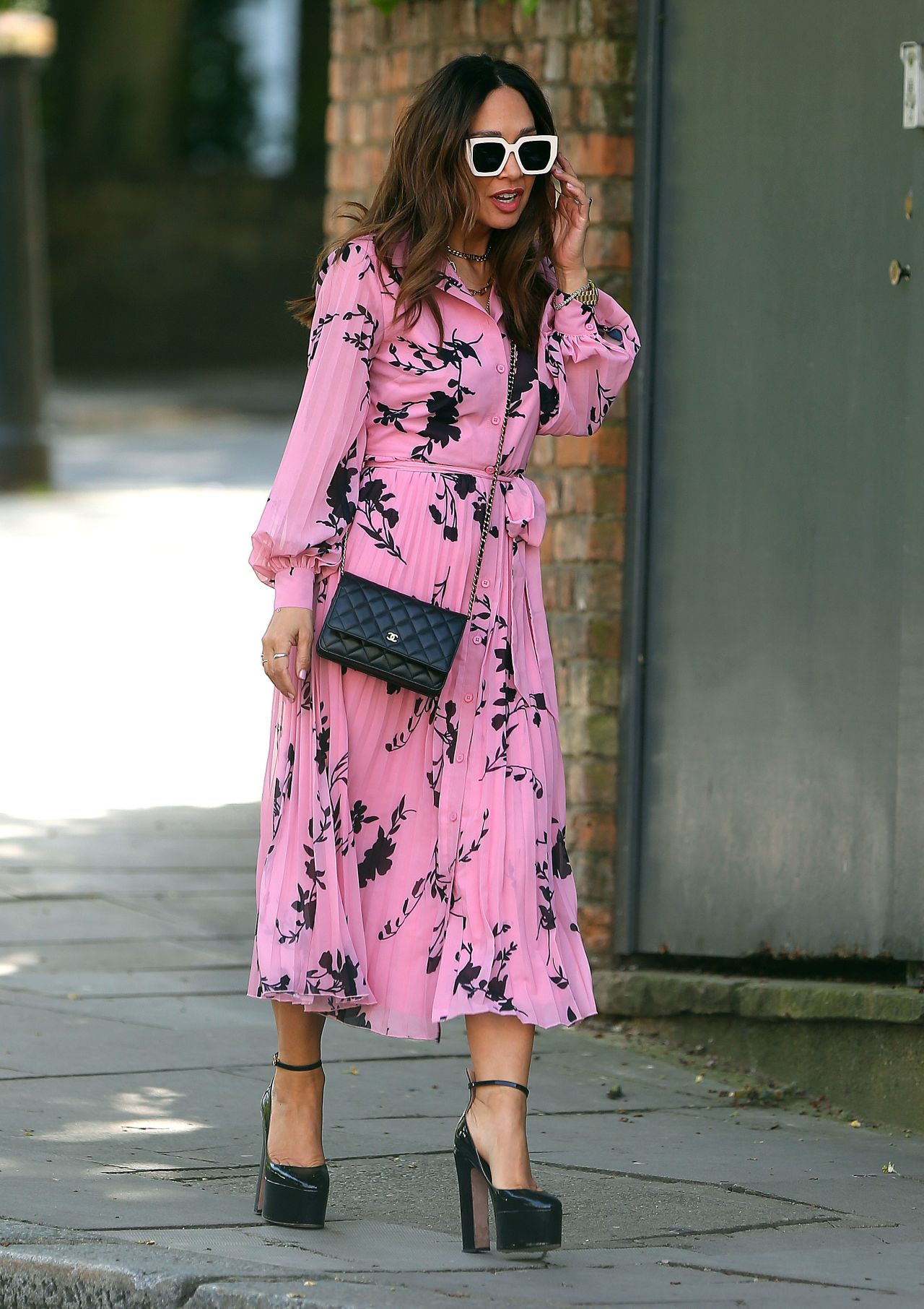 Myleene Klass in a Pink Floral Tropical Shirt Dress and White Shades ...