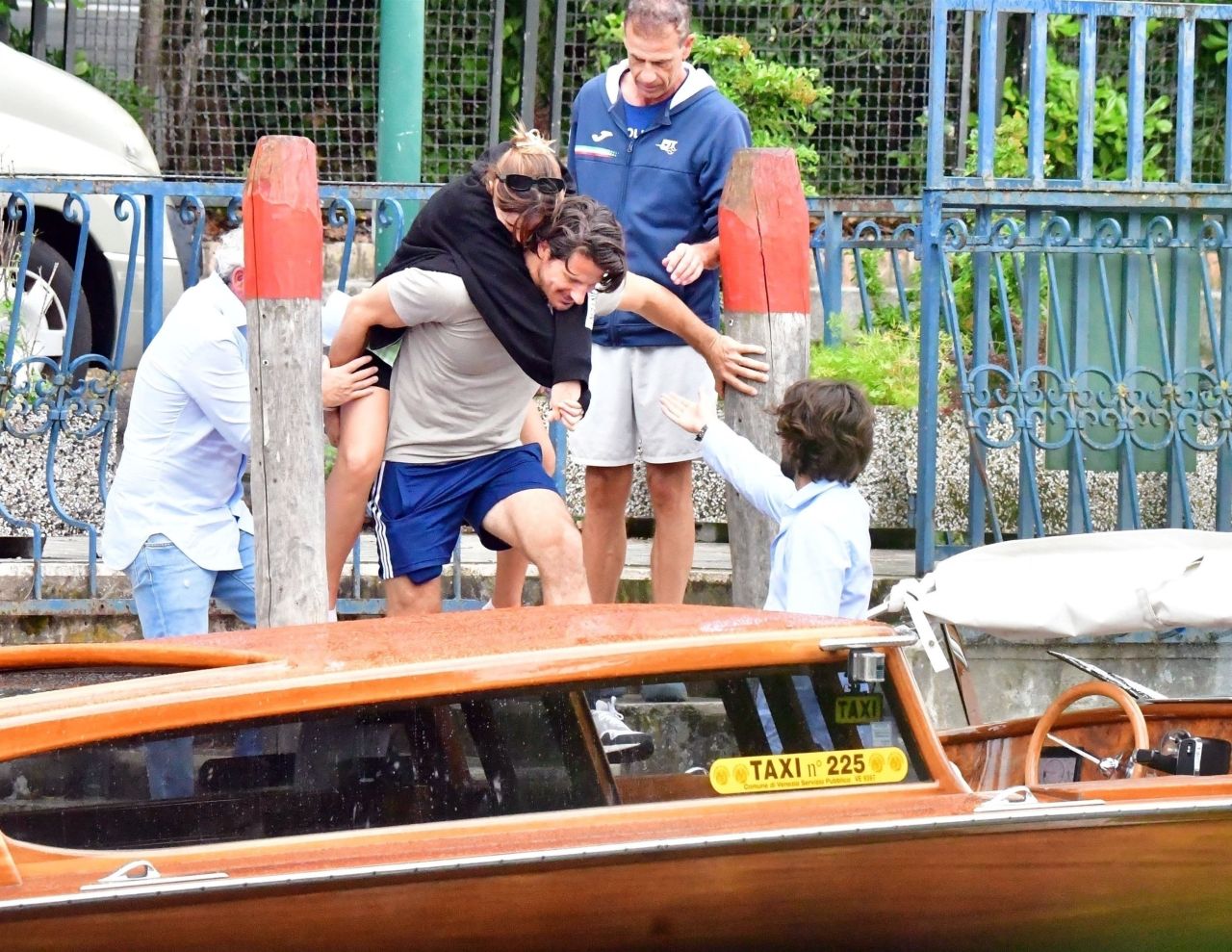 Emma Watson enjoys piggyback ride on Ryan Kohn while out in Venice Lido,  Italy