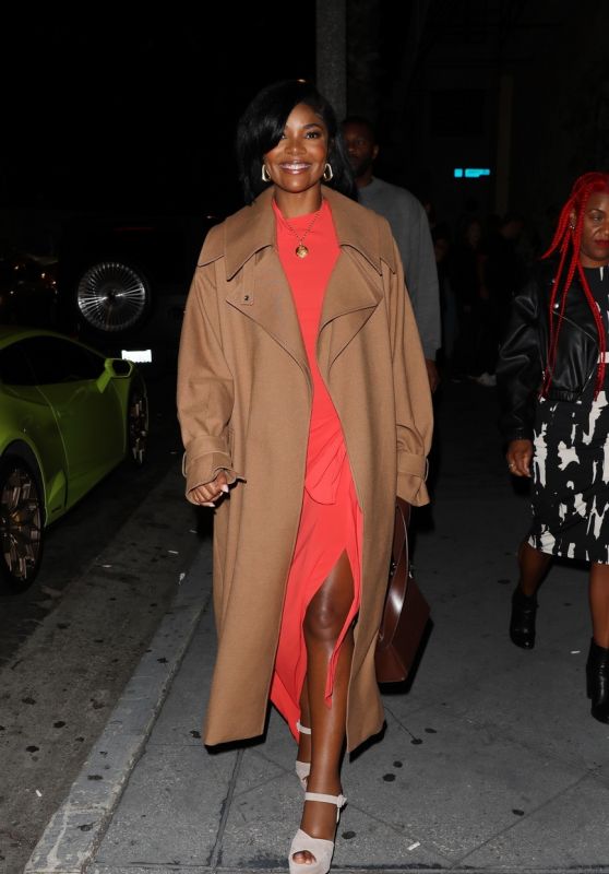 Gabrielle Union Wearing an Orange Dress and a Long Brown Coat at the Fleur Room Lounge in West Hollywood 06/11/2023