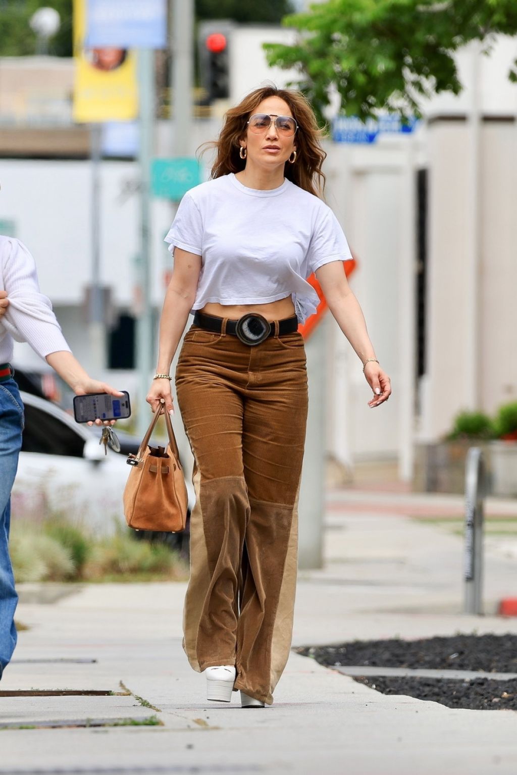 Jennifer Lopez in Brown Corduroy Pants and a White T-shirt in West ...