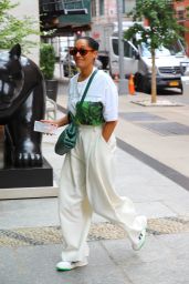 Tracee Ellis Ross in White Pants and a Green Bottega Veneta Purse - Soho 06/12/2023
