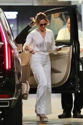 Jennifer Lopez in a White Trousers With a Tucked in Blouse While Carrying Valentino Handbag in Beverly Hills 07/20/2023