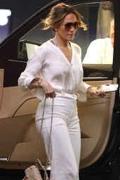 Jennifer Lopez in a White Trousers With a Tucked in Blouse While Carrying Valentino Handbag in Beverly Hills 07/20/2023