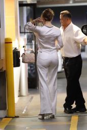 Jennifer Lopez in a White Trousers With a Tucked in Blouse While Carrying Valentino Handbag in Beverly Hills 07/20/2023