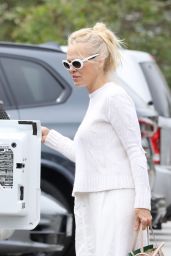 Pamela Anderson in a White Sweater Paired With a White Skirt and Matching White Frame Sunglasses - Malibu 07/09/2023