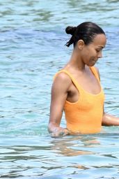 Zoe Saldana Wearing Striking Orange Swimsuit in Sardinia 07/23/2023
