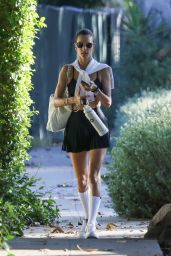 Alessandra Ambrosio in a Black Mini Skirt and Matching Top and White Sneakers in Santa Monica 08/12/2023