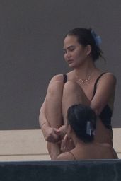 Chrissy Teigen in a Black Swimsuit in Puerto Vallarta 08/08/2023