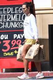 Jordana Brewster Wearing a Popular T-shirt That Reads "Happy Life. Happy Human Beings. Happy Oceans" and a Pair of Yellow Shorts in Santa Barbara 08/15/2023