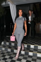 Kim Kardashian in a Striking Grey Long-Sleeve Unitard and Stylish Snakeskin Boots in West Hollywood 08/14/2023