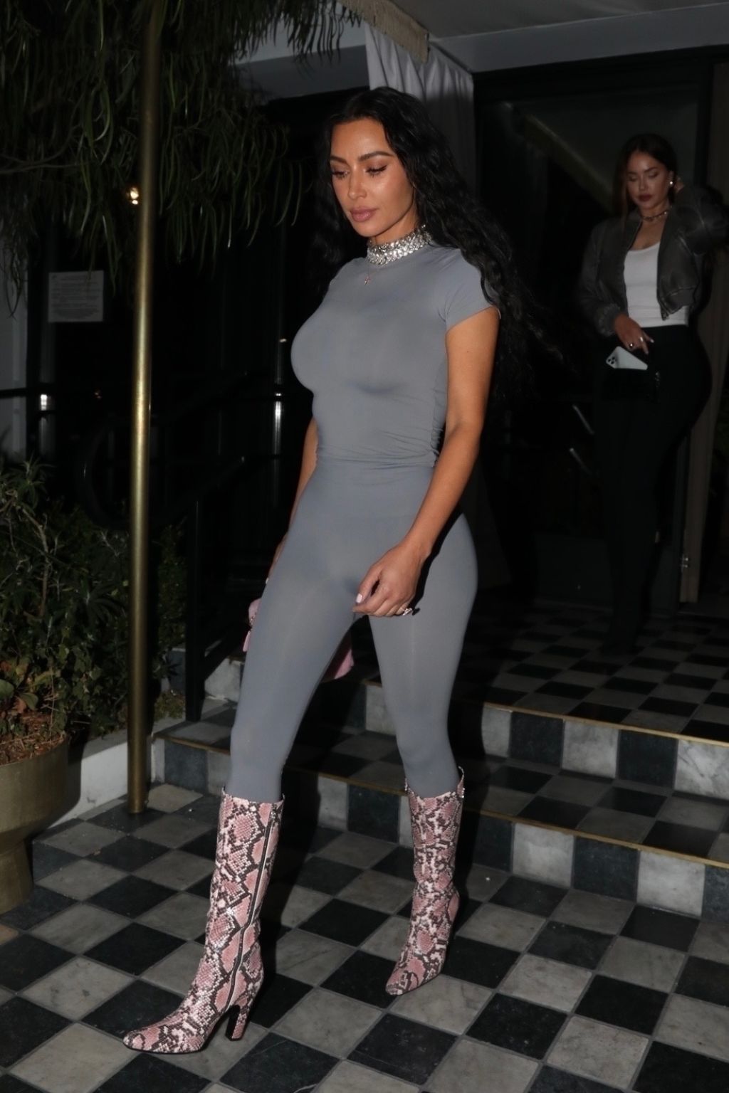 Kim Kardashian in a Striking Grey Long-Sleeve Unitard and Stylish