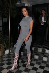 Kim Kardashian in a Striking Grey Long-Sleeve Unitard and Stylish Snakeskin Boots in West Hollywood 08/14/2023