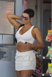 Nicole Murphy in All-white Attire Pumping Gas in Calabasas 08/01/2023