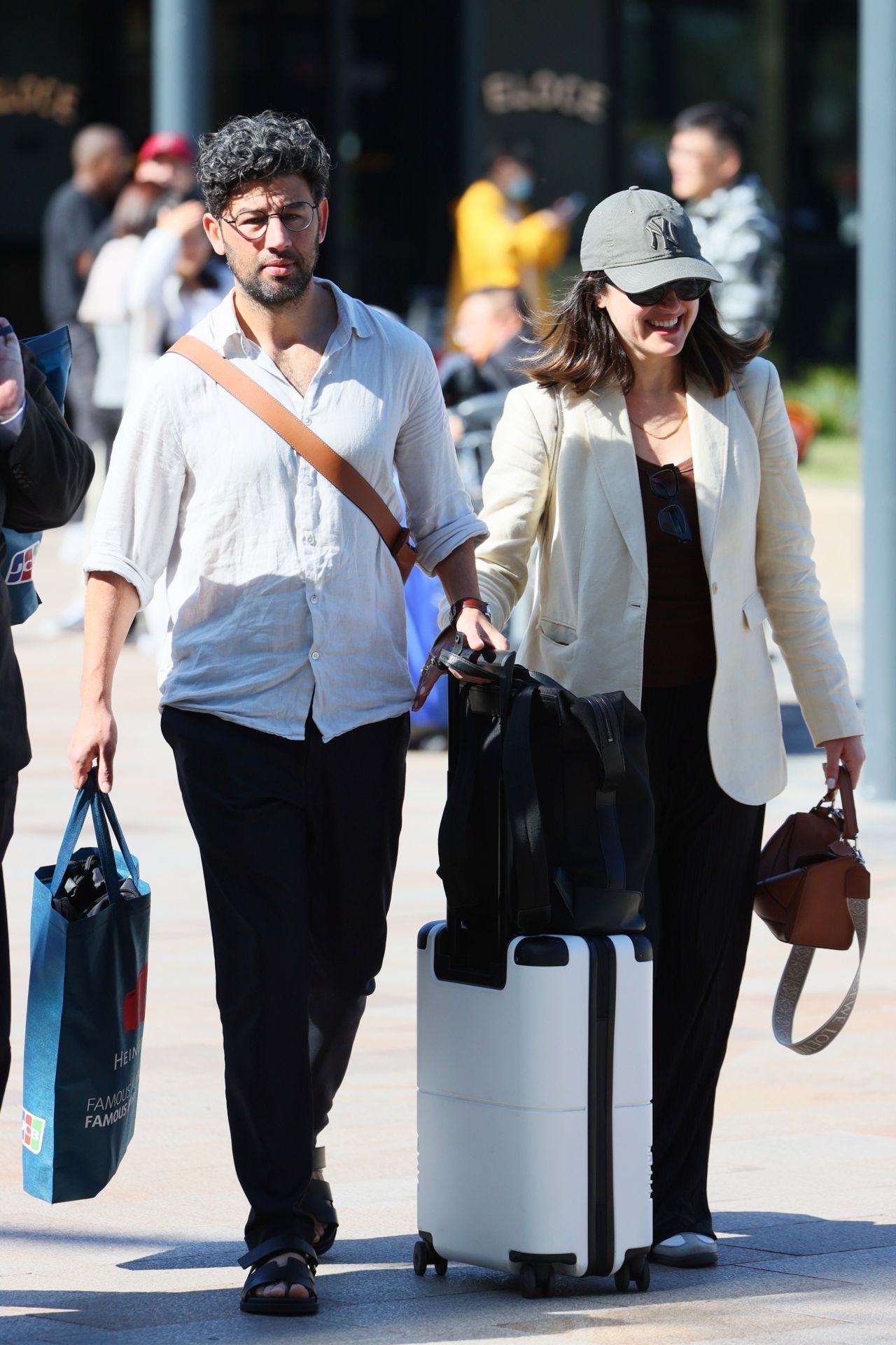 Sarah Abo and Husband Cyrus Moran at Sydney Airport 08/27/2023 • CelebMafia