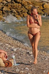 Sienna Miller in a Bikini on the Beach in Ibiza 08/20/2023