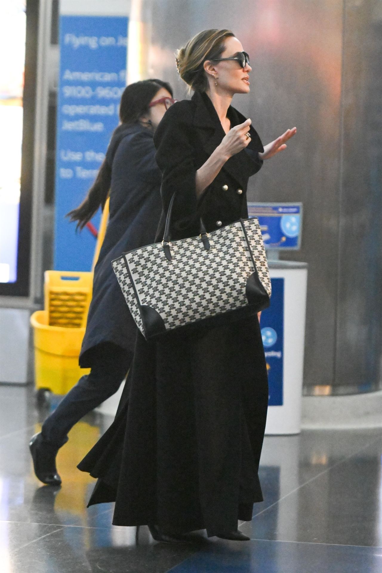 Angelina Jolie Sports Dior Trench & Celine Tote Bag at JFK