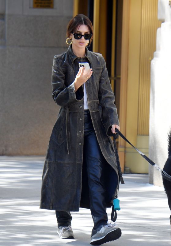 Emily Ratajkowski a Long Brown Leather Trench Coat With Black Leather Slacks - New York 09/27/2023