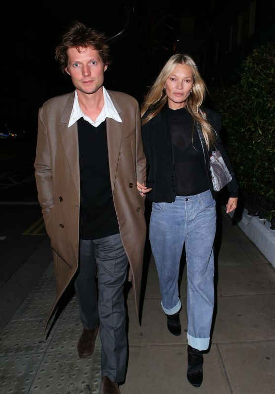 Kate Moss Wearing a Short Black Blazer, Shear Top, Jeans and Boots - London 09/23/2023
