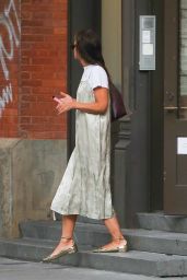 Katie Holmes in a Silver Satin Dress and Shiny Gold Shoes in New York 09/11/2023