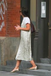Katie Holmes in a Silver Satin Dress and Shiny Gold Shoes in New York 09/11/2023