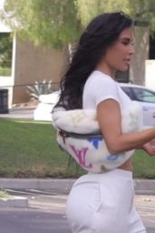 Kim Kardashian in a White Crop Top and Trousers in Los Angeles 09/28/2023