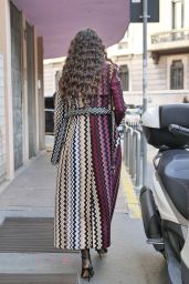 Paola Turani Wears a Black Turtleneck Ribbed Top, Mini Shorts and a Purple Orange and Blue Geometric Pattern Print Long Trench Coat s Outside the Missoni Show in Milan 09/23/2023