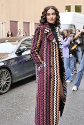 Paola Turani Wears a Black Turtleneck Ribbed Top, Mini Shorts and a Purple Orange and Blue Geometric Pattern Print Long Trench Coat s Outside the Missoni Show in Milan 09/23/2023