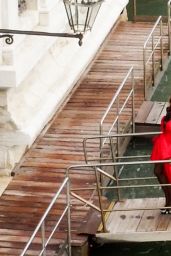 Rita Ora in Long Moschino Red Dress in Venice 08/30/2023