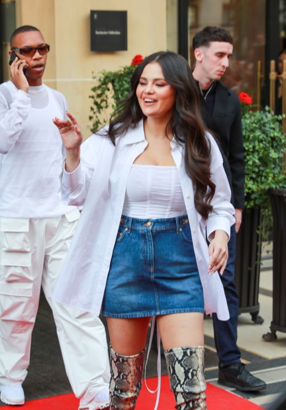 Selena Gomez in a Denim Skirt and Knee-high Snakeskin Boots at Manko in Paris 09/26/2023