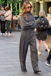 Abbey Clancy Wearing a Crop Top and Smart Trousers - Leicester Square in London 10/10/2023