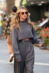 Abbey Clancy Wearing a Crop Top and Smart Trousers - Leicester Square in London 10/10/2023