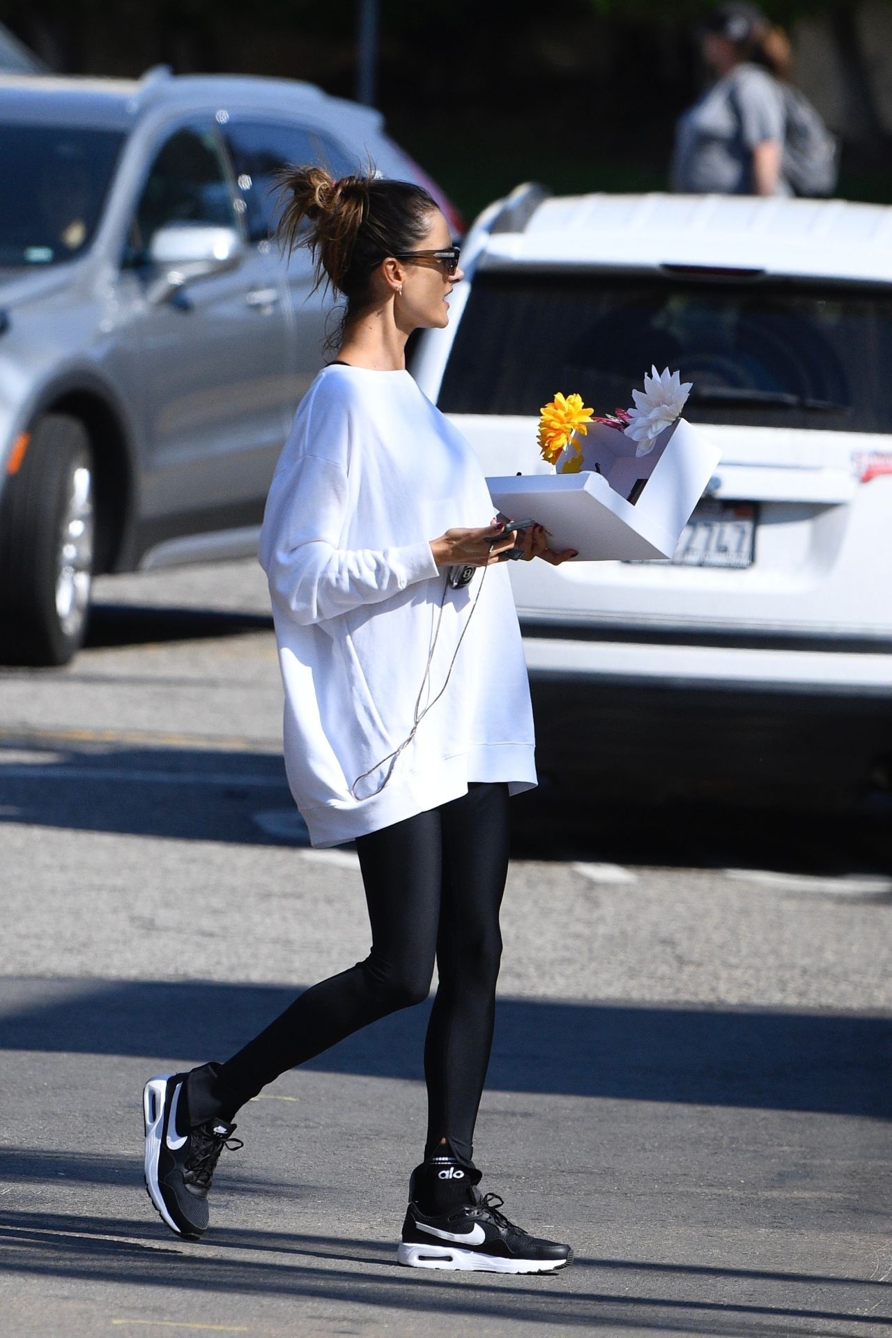 Alessandra Ambrosio With Flower Bouquet in Hand - Brentwood 10/27/2023