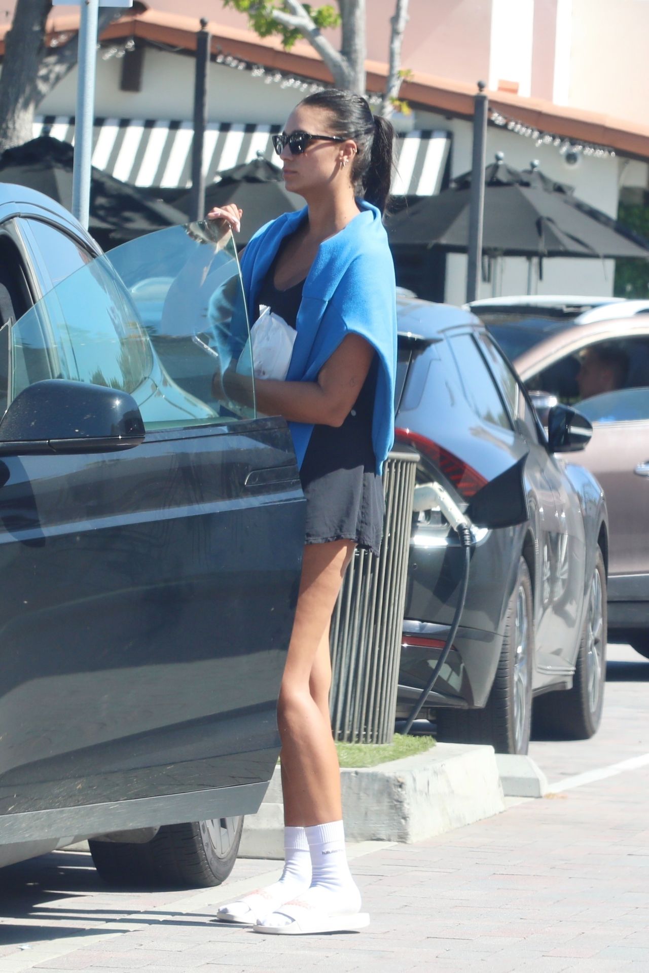 April Love Geary Wearing a Black Mini Dress - Shopping in Malibu 10/11