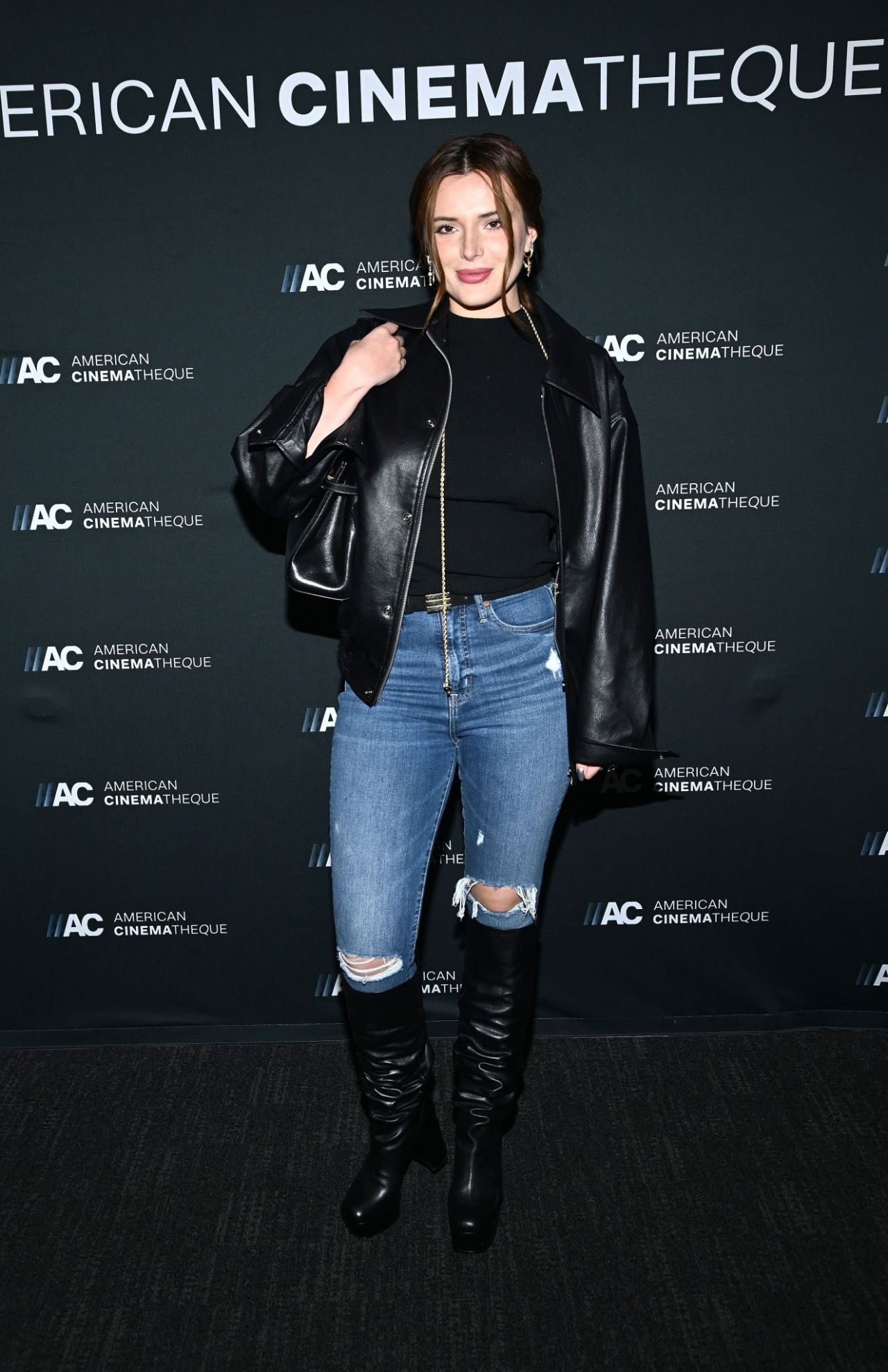 Bella Thorne Looking Great in Leather Jacket, Jeans and Boots