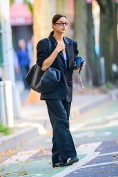 Irina Shayk in a Black Oversized Blazer, Matching Trousers and Leather Tote - NYC 10/05/2023