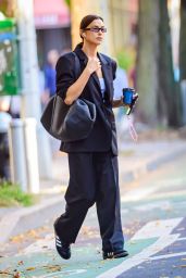 Irina Shayk in a Black Oversized Blazer, Matching Trousers and Leather Tote - NYC 10/05/2023