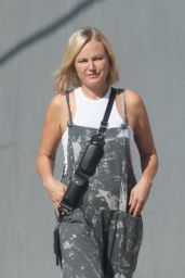 Malin Akerman in Gray Overalls Paired With White Sneakers 10/27/2023