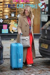 Kate Garraway Wearing Bright Red Flared Trousers and Bright Top - London 11/02/2023