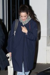 Marion Cotillard in Jeans and a Blue Coat Paired With Chanel Boots in Paris 11/09/2023