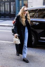 Sophie Turner in a Black Trench Coat, Matching Blouse, Jeans and Black Loafers in NY 11/02/2023