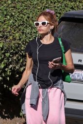 Eva Mendes in Pink PANGAIA Sweatpants, Black Top and Green Bag in Santa Barbara 12/04/2023